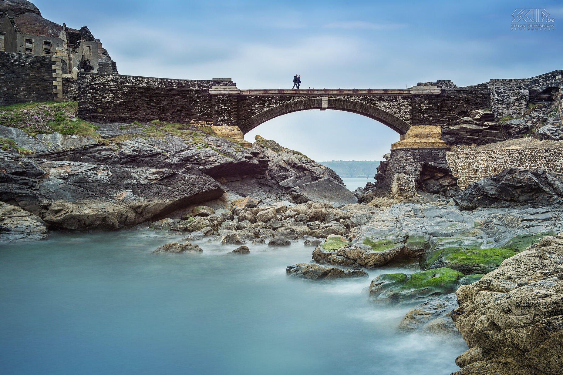 Crozon - Fort des Capucins Long exposure shot of the bridge of the fort at the rocky islet of the Capuchins near the commune of Roscanvel. I first created a couple of long exposure shots and then I removed my bigstopper filter to make some shots of the people walking on the bridge. In Photoshop I merged the 2 persons on the bridge with the long exposure photo. Stefan Cruysberghs